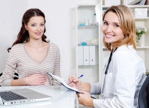 Doctor and young smiling woman