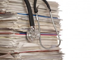Stack of papers with stethoscope