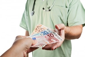 Patient paying to the doctor.