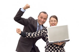 business couple receiving good news and celebrating