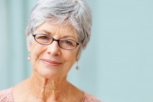 Closeup portrait of a beautiful retired senior woman smiling