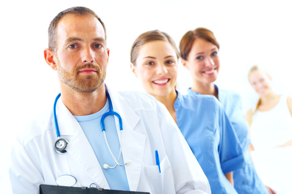 A portrait of doctor with two attractive nurses in the background 
attractive blue Care charts clean Clinic clinical coat colleague colleagues consultant co-workers physicians Doctor environment examination faces females friendly heal health healthcare healthy hospital job kind light male man mature Medical medicinal medicine Nurse people portrait profession professional smile smiling specialist stethoscope successful physician uniform ward white women work working