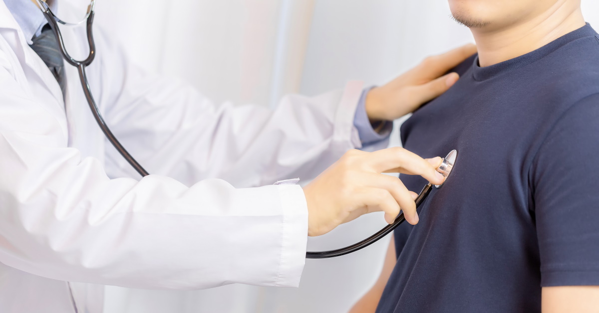 Doctor examination young man with stethoscope in hospital. healthcare and medicine