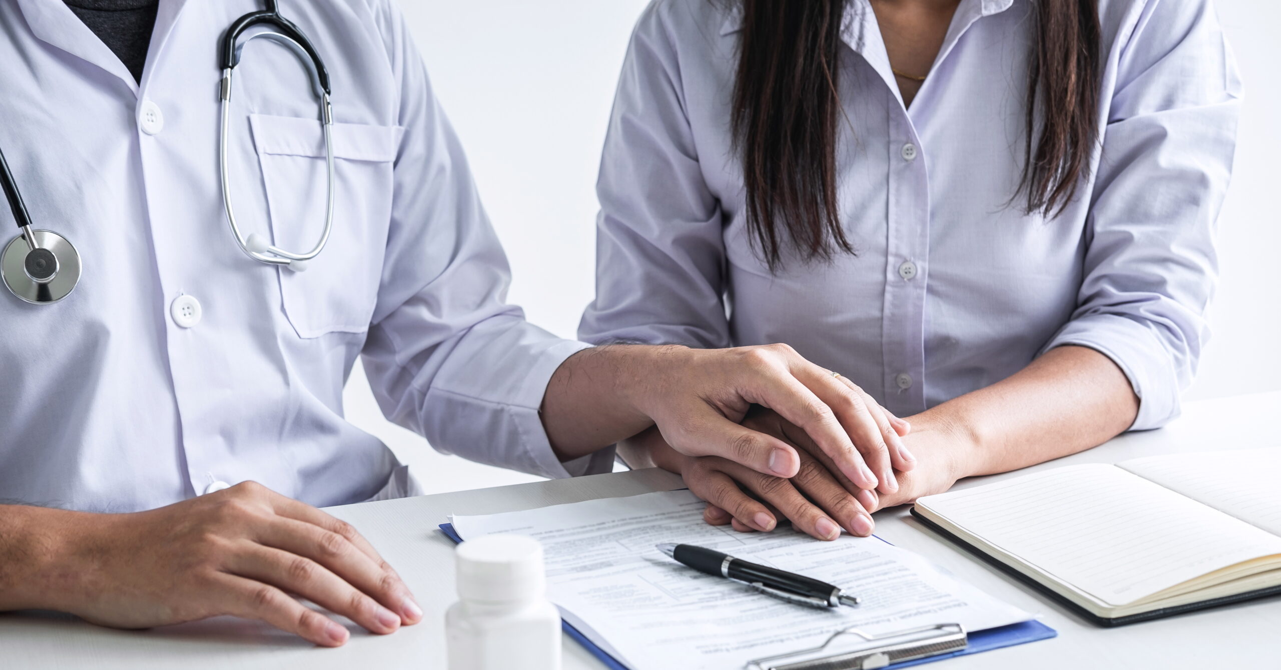 Image of doctor holding patient's hand to encourage, talking with patient cheering and support, healthcare and medical assistant.